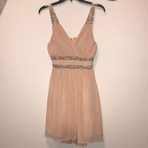 Light pink sequins dress.